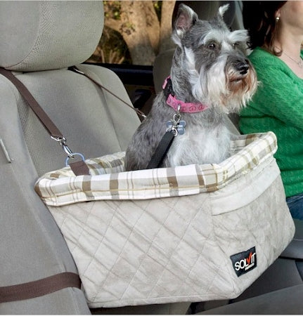 PetSafe large pet booster seat in beige quilted fabric with a small dog inside secured in car