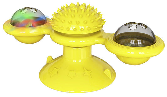 Yellow spinning cat toy with textured center and two clear domes for interactive pet play