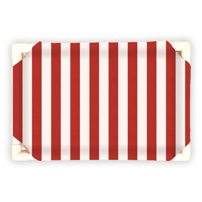 Striped pet bed for Christmas with red and white vertical stripes on a rectangular cushioned surface