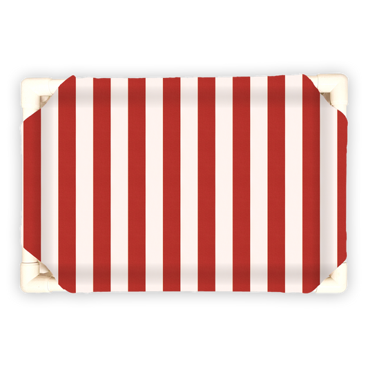 Striped pet bed for Christmas with red and white vertical stripes on a rectangular cushioned surface