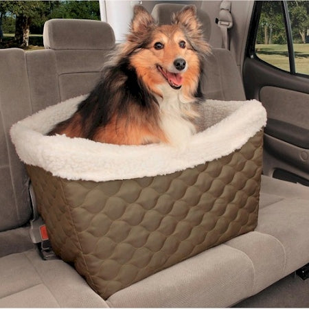PetSafe Tagalong pet booster seat with soft fleece lining and quilted exterior holding a happy dog in car