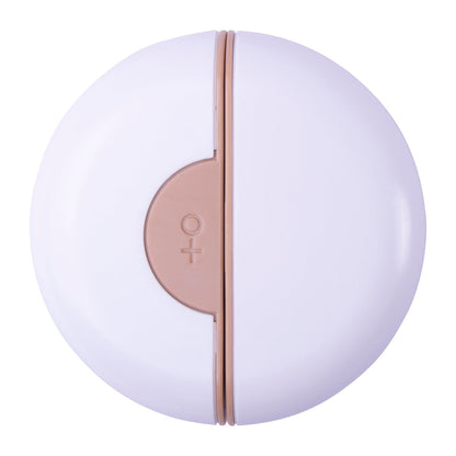 Compact round travel pet grooming comb in white and beige for easy on-the-go pet care