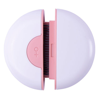 Compact round travel pet grooming comb in pink and white for easy pet hair care on the go