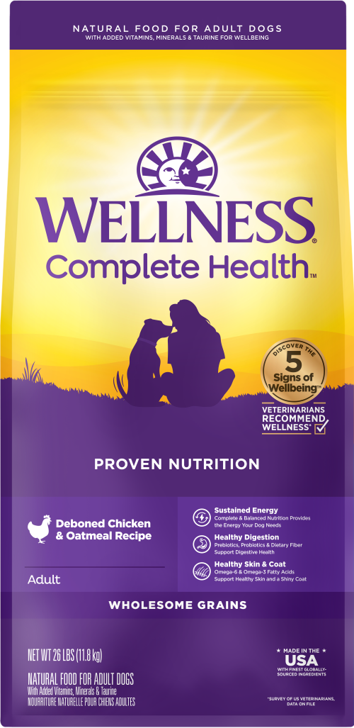 Wellness Complete Health dog food in a 26 lb bag featuring a chicken and oatmeal recipe for adult dogs