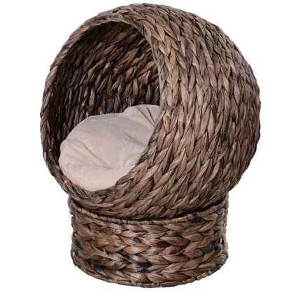Wicker cat bed with cushion in a cozy covered dome shape for comfortable pet resting
